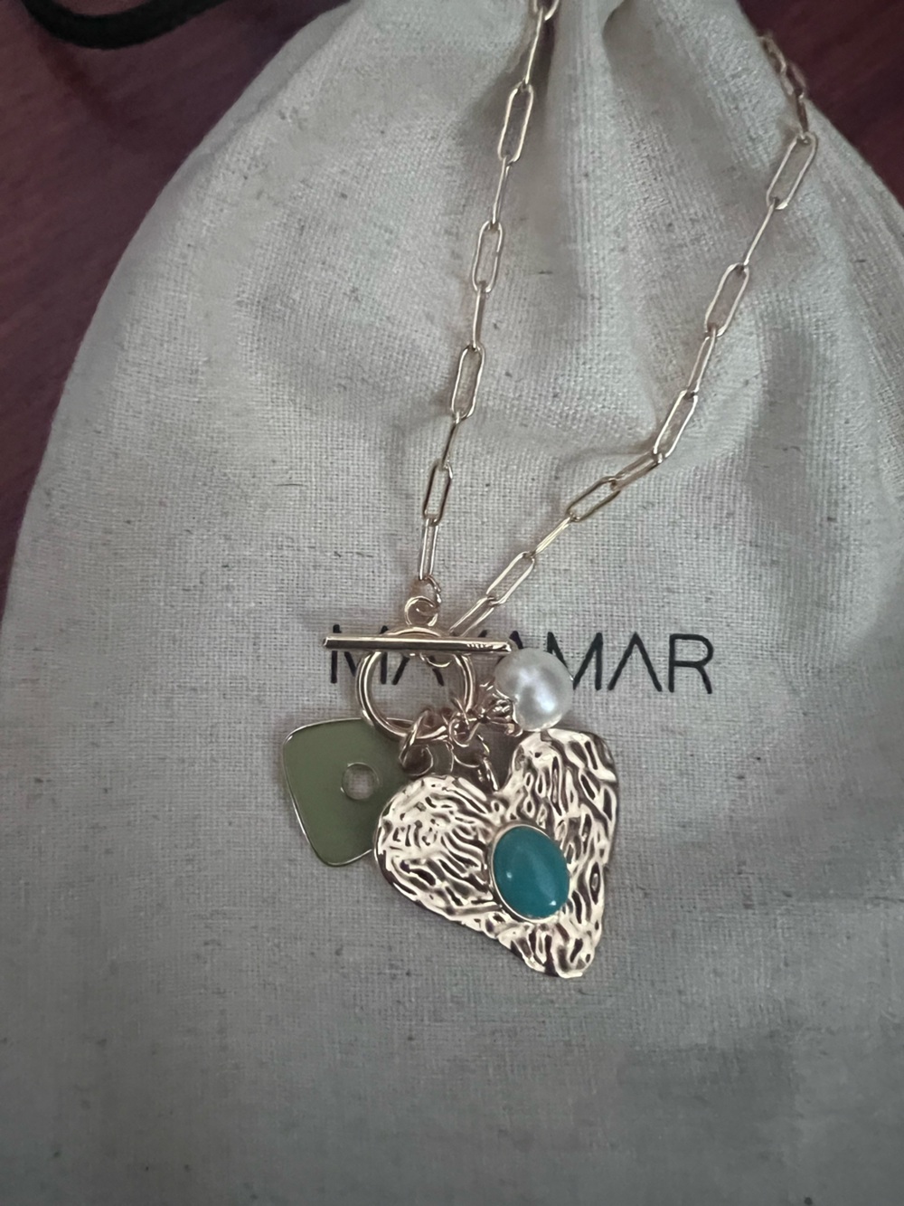 Mayamar gold paper clip necklace with green enamel and heart &pearl pendant.